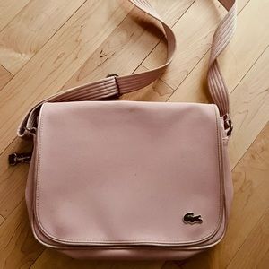 Lacoste crossbody purse need to clean the outside. Inside perfect-no rips/tears